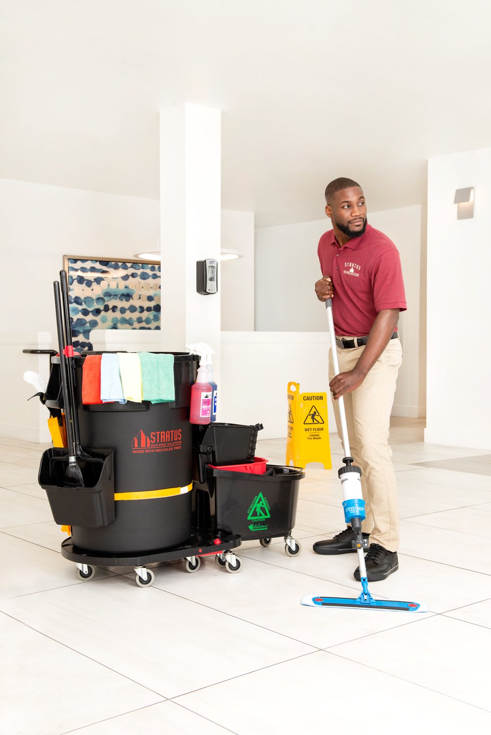 Stratus worker cleaning hard flooring, commercial cleaning worker, Stratus Worker